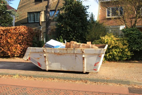 Professional garden clearance equipment in use